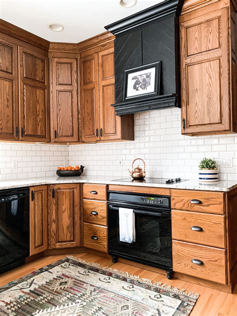 oak cabinets with black steel appliances|how to modernize oak cabinets.